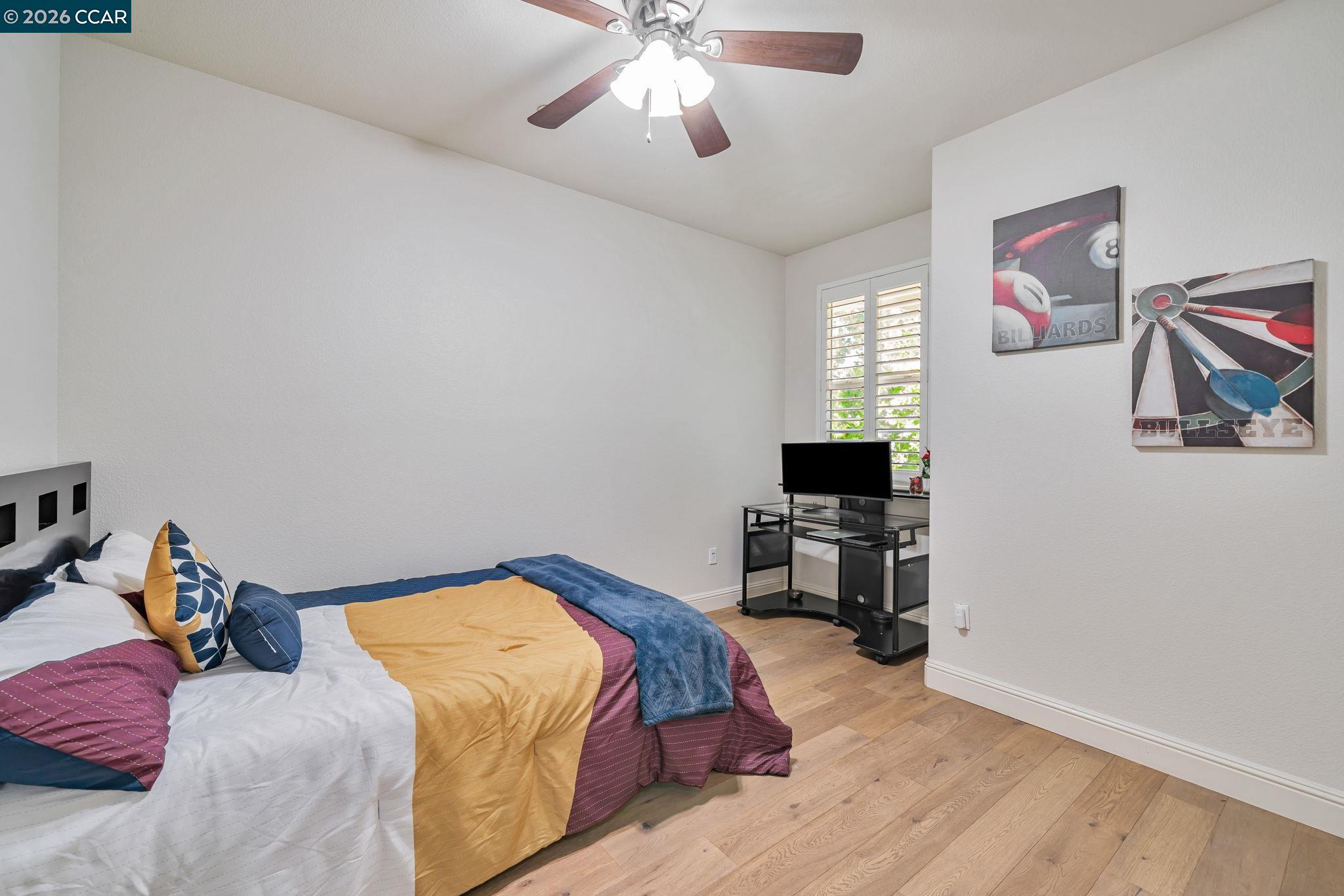 6260 Main Branch Road San Ramon, CA 94582 - Photo 26 of 38 a bedroom with a bed and a chandelier