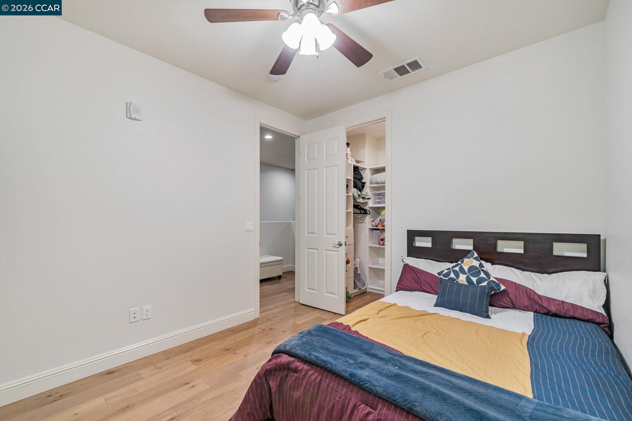 6260 Main Branch Road San Ramon, CA 94582 - Photo 27 of 38 a bedroom with a bed and wooden floor
