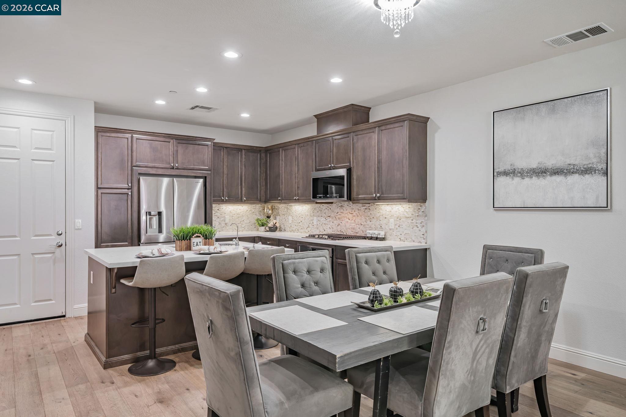 6260 Main Branch Road San Ramon, CA 94582 - Photo 9 of 38 a kitchen with a dining table chairs and refrigerator