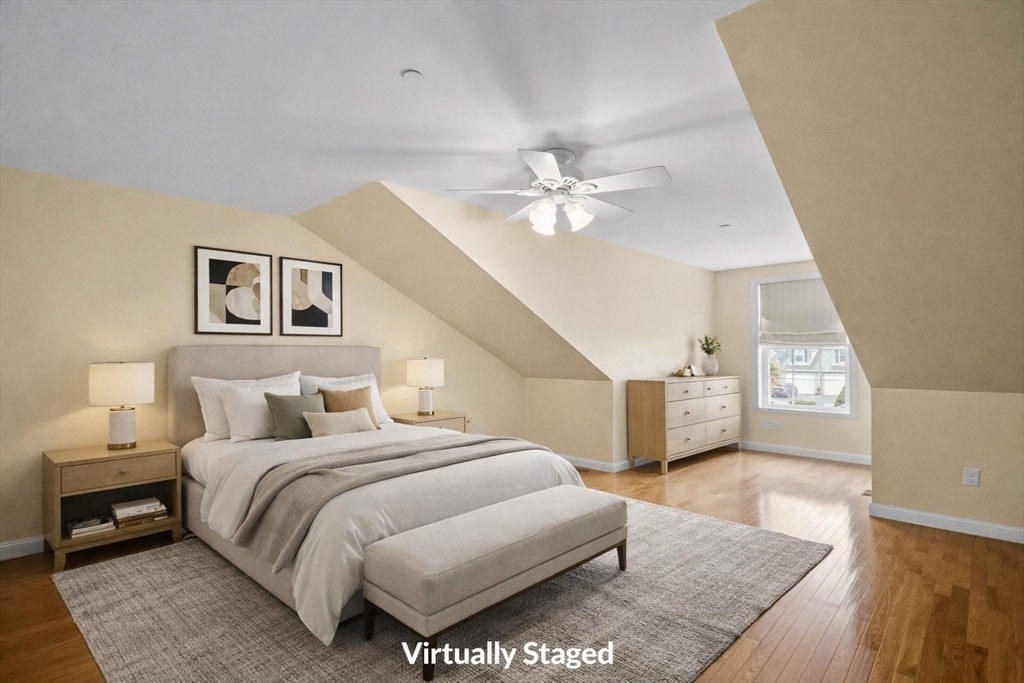 170 Beach Road, Unit 52 Salisbury, MA 01952 - Photo 21 of 34 a spacious bedroom with a bed and a chandelier