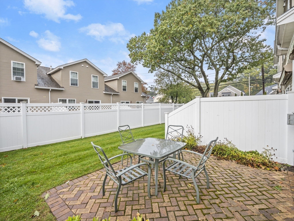 170 Beach Road, Unit 52 Salisbury, MA 01952 - Photo 28 of 34 a patio with table and chairs