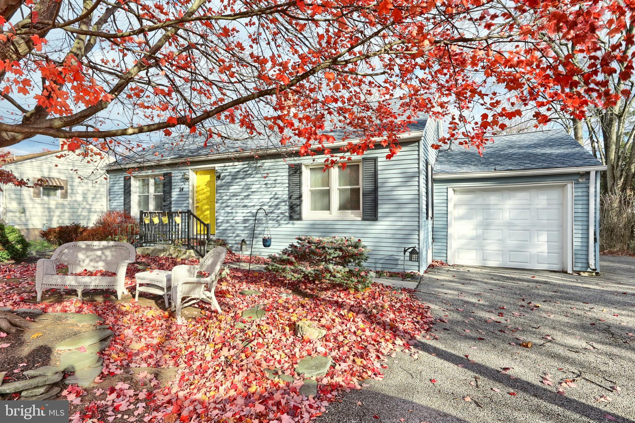 34 Redding Lane Gettysburg, PA 17325 - Photo 5 of 40 a view of a house with backyard sitting area and garden