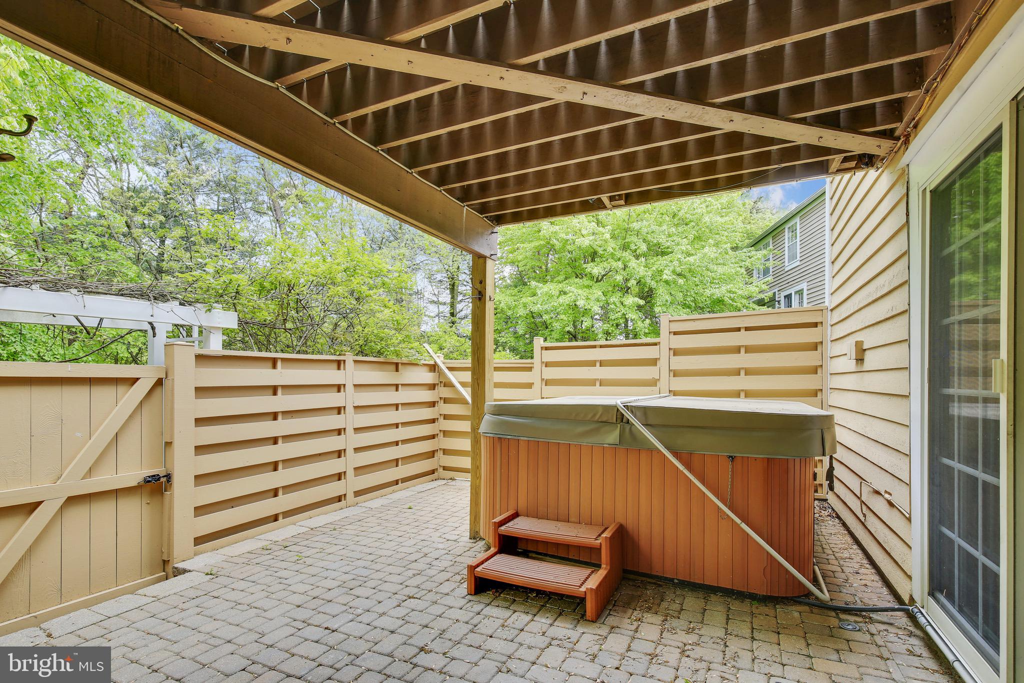 1530 Deer Point Way Reston, VA 20194 - Photo 32 of 42 a view of a deck with wooden floor and roof with a small yard