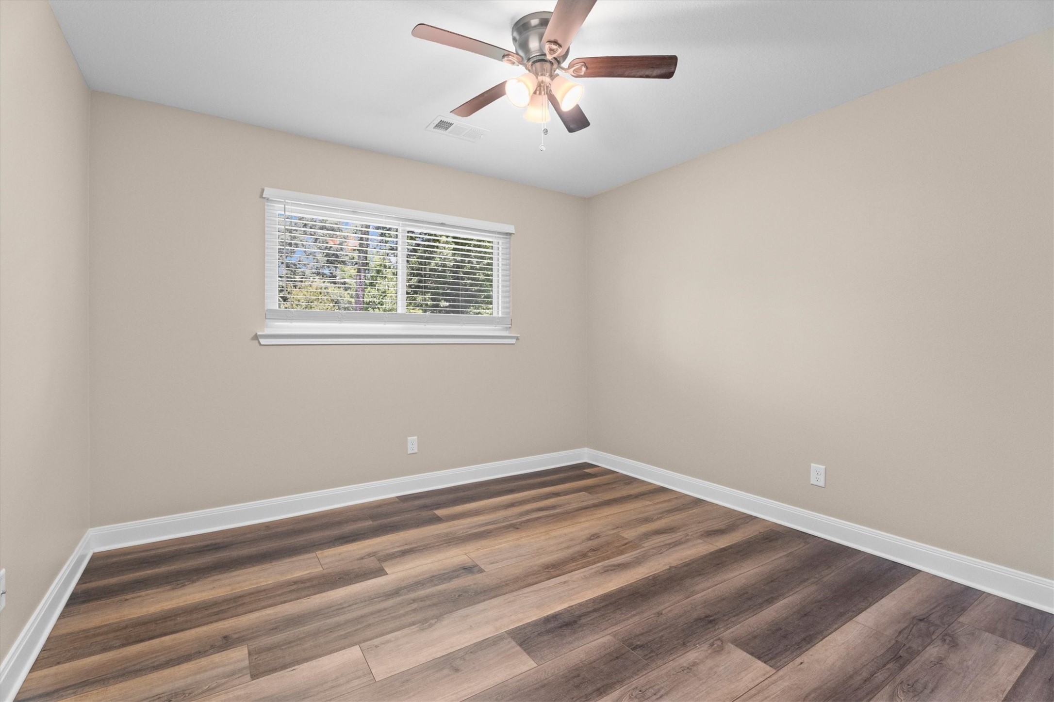 6530 Bayonne Drive Spring, TX 77389 - Photo 24 of 37 a view of a room with a ceiling fan and a window