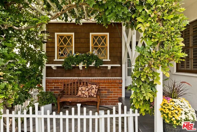 a wooden fence with window in the back