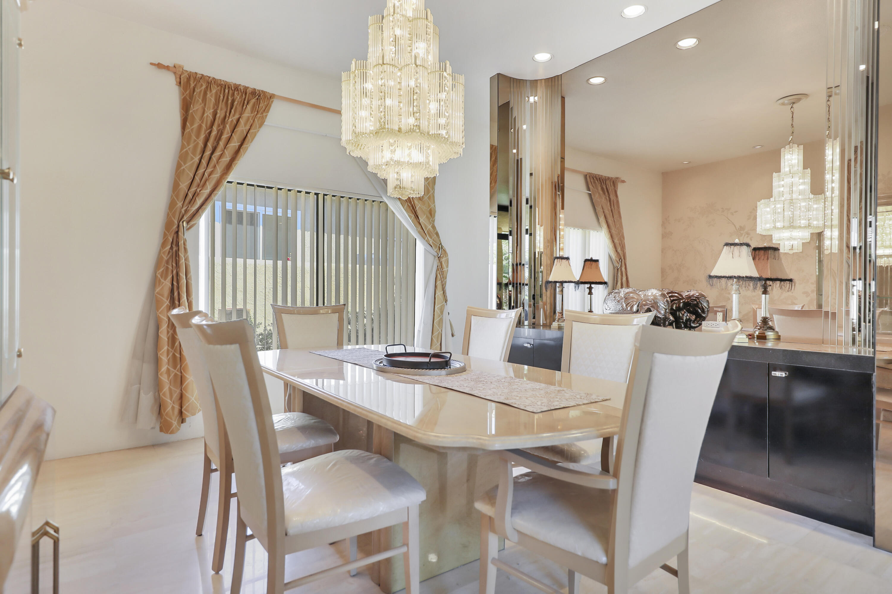 43721 Port Maria Road Bermuda Dunes, CA 92203 - Photo 11 of 37 a dining room with furniture a chandelier and wooden floor