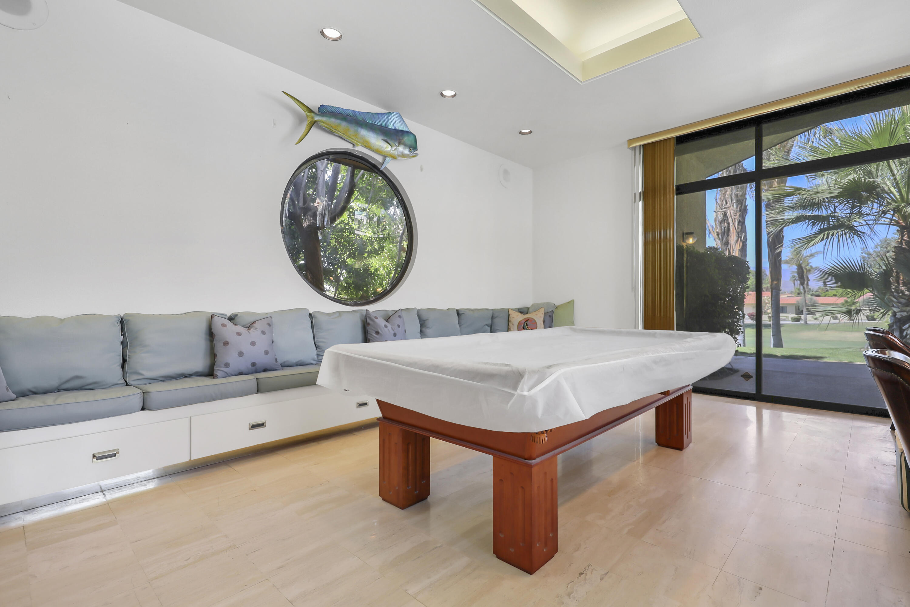 43721 Port Maria Road Bermuda Dunes, CA 92203 - Photo 17 of 37 a living room with a table and a large window