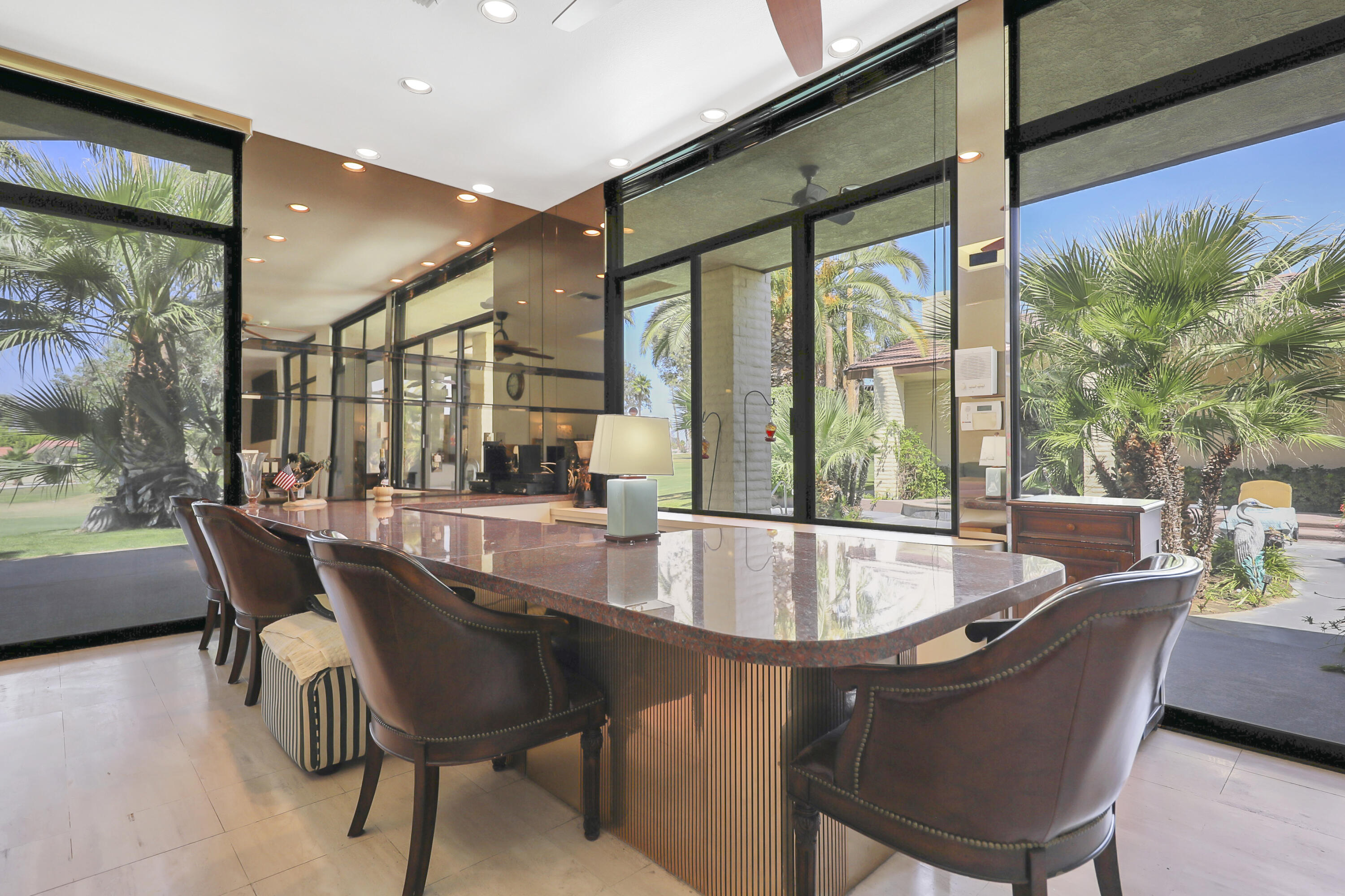 43721 Port Maria Road Bermuda Dunes, CA 92203 - Photo 18 of 37 a dining room with furniture and a floor to ceiling window