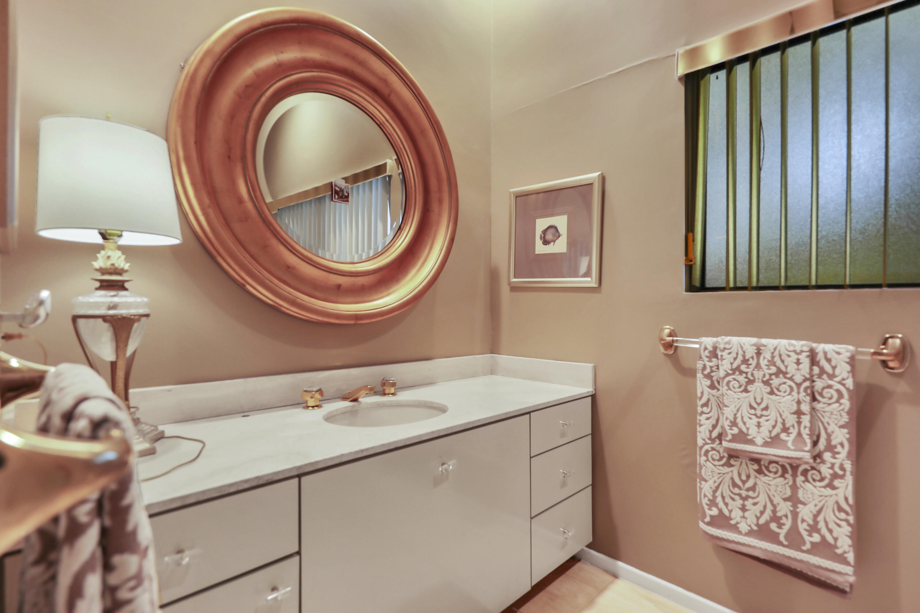 43721 Port Maria Road Bermuda Dunes, CA 92203 - Photo 20 of 37 a bathroom with a sink and a mirror