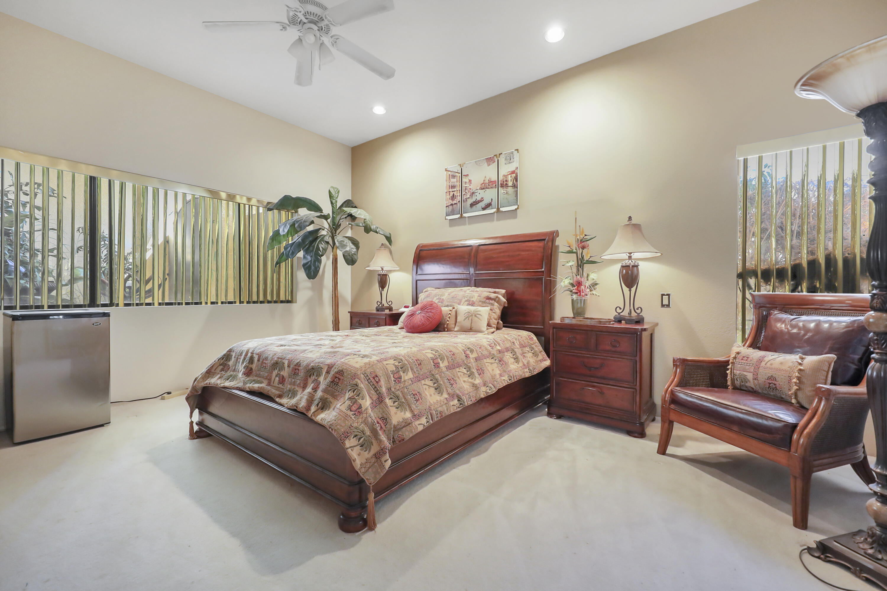 43721 Port Maria Road Bermuda Dunes, CA 92203 - Photo 21 of 37 a bedroom with a bed and a chandelier