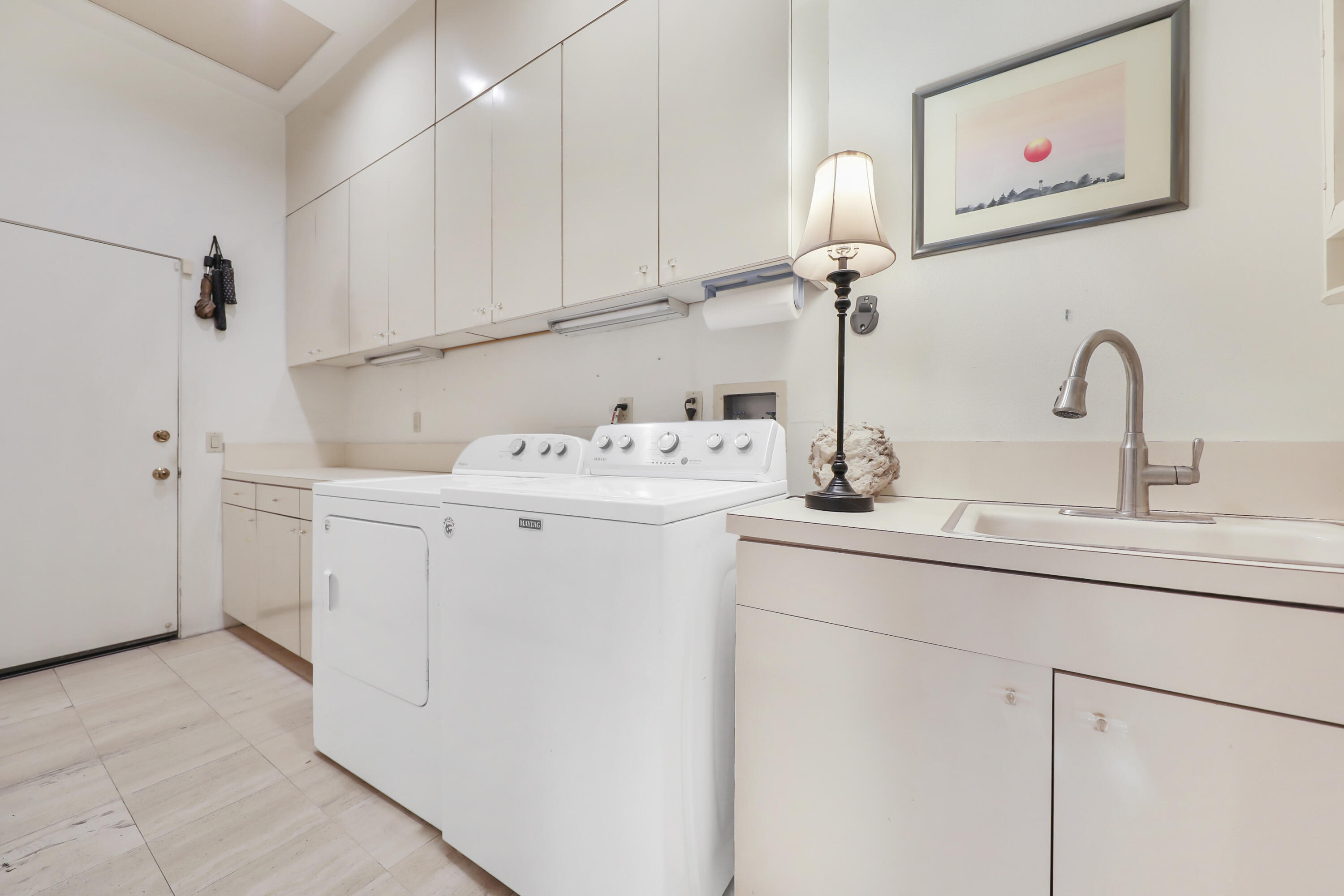 43721 Port Maria Road Bermuda Dunes, CA 92203 - Photo 30 of 37 a utility room with sink dryer and washer