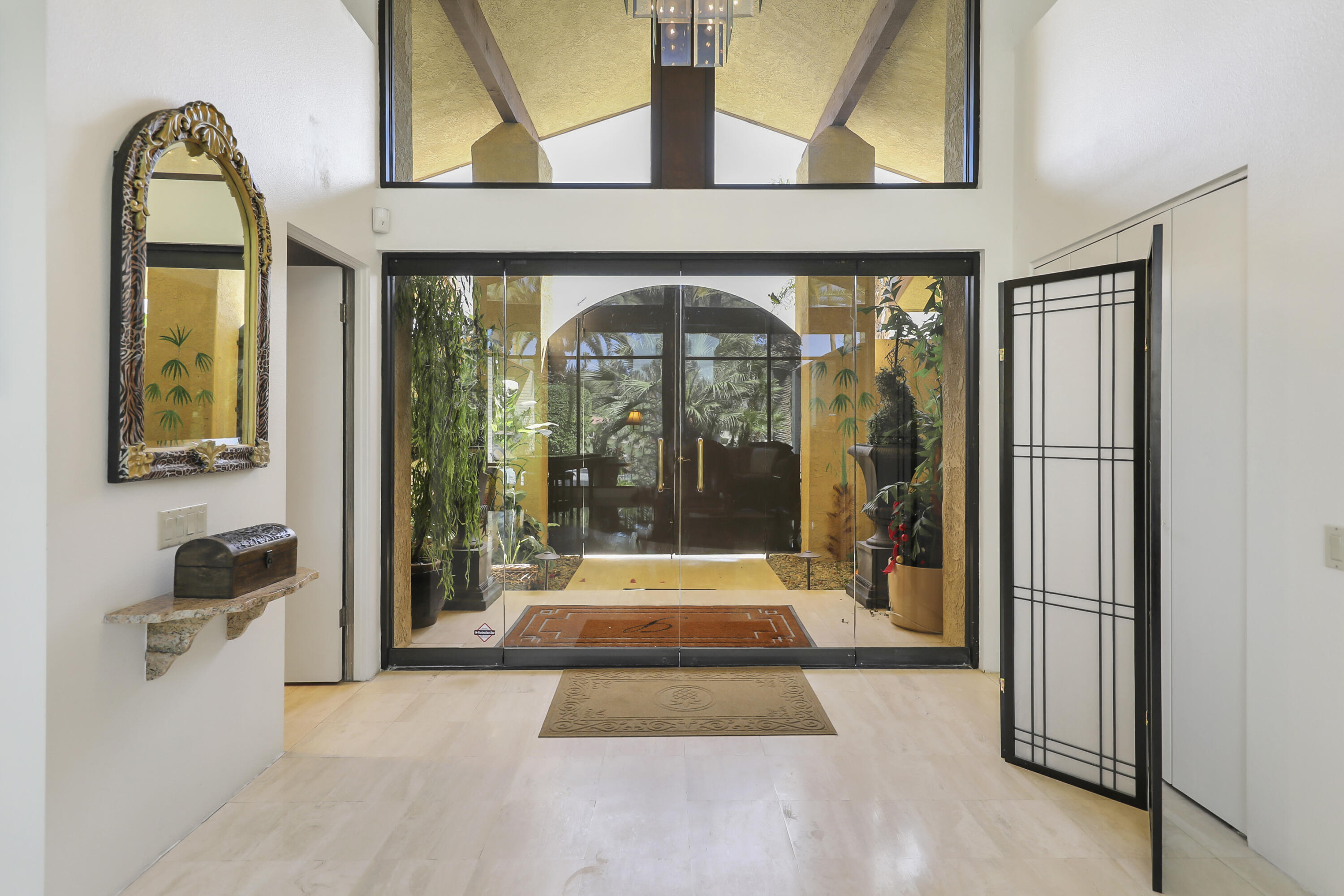 43721 Port Maria Road Bermuda Dunes, CA 92203 - Photo 6 of 37 a hallway with sliding door and glass door