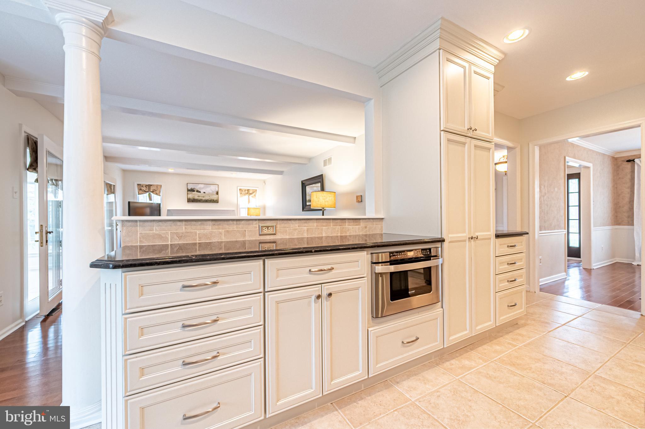 13 Pointe View Drive Medford, NJ 08055 - Photo 12 of 33 a kitchen with granite countertop white cabinets and white appliances