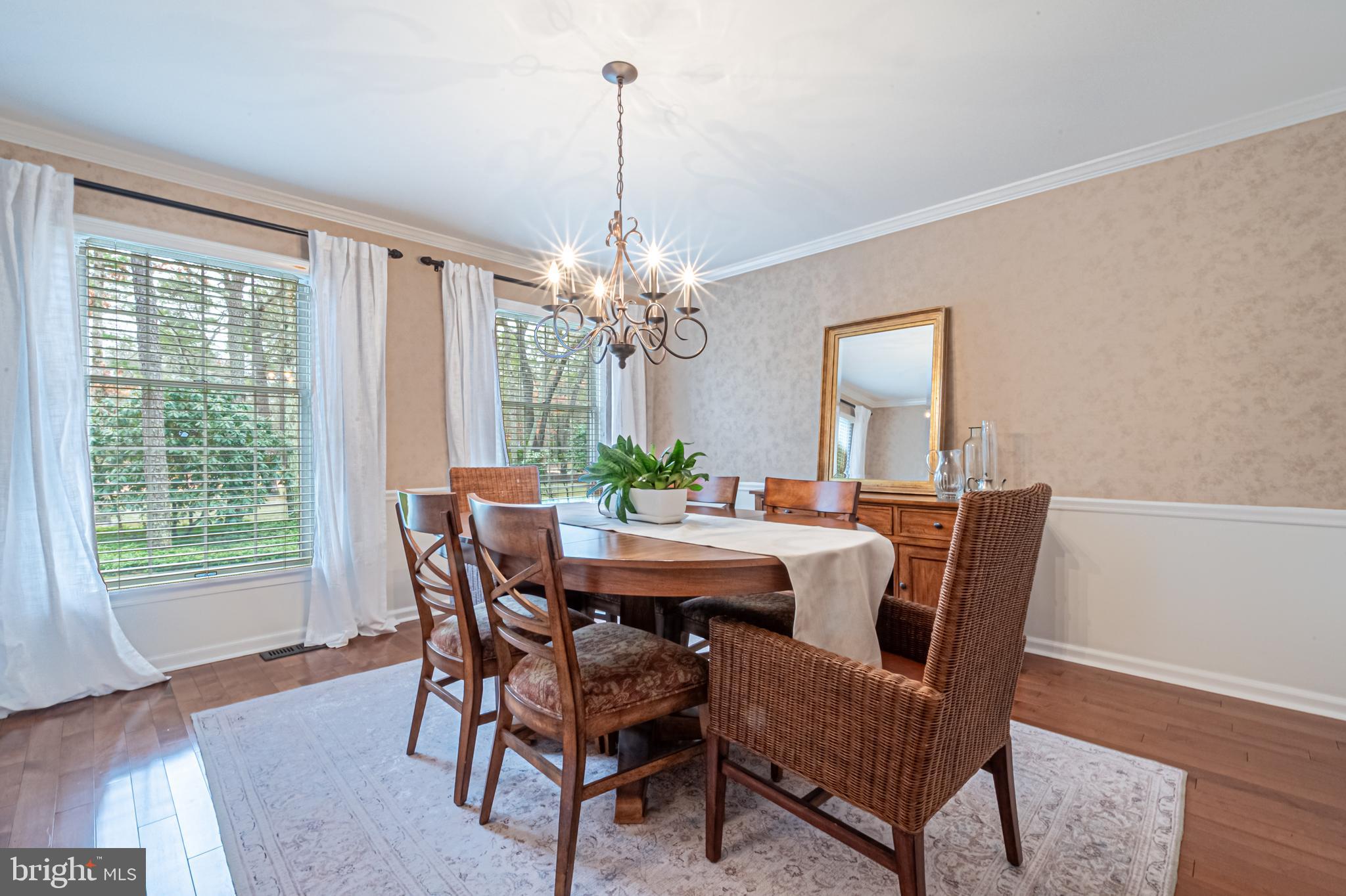 13 Pointe View Drive Medford, NJ 08055 - Photo 15 of 33 a dining room with furniture a chandelier and wooden floor
