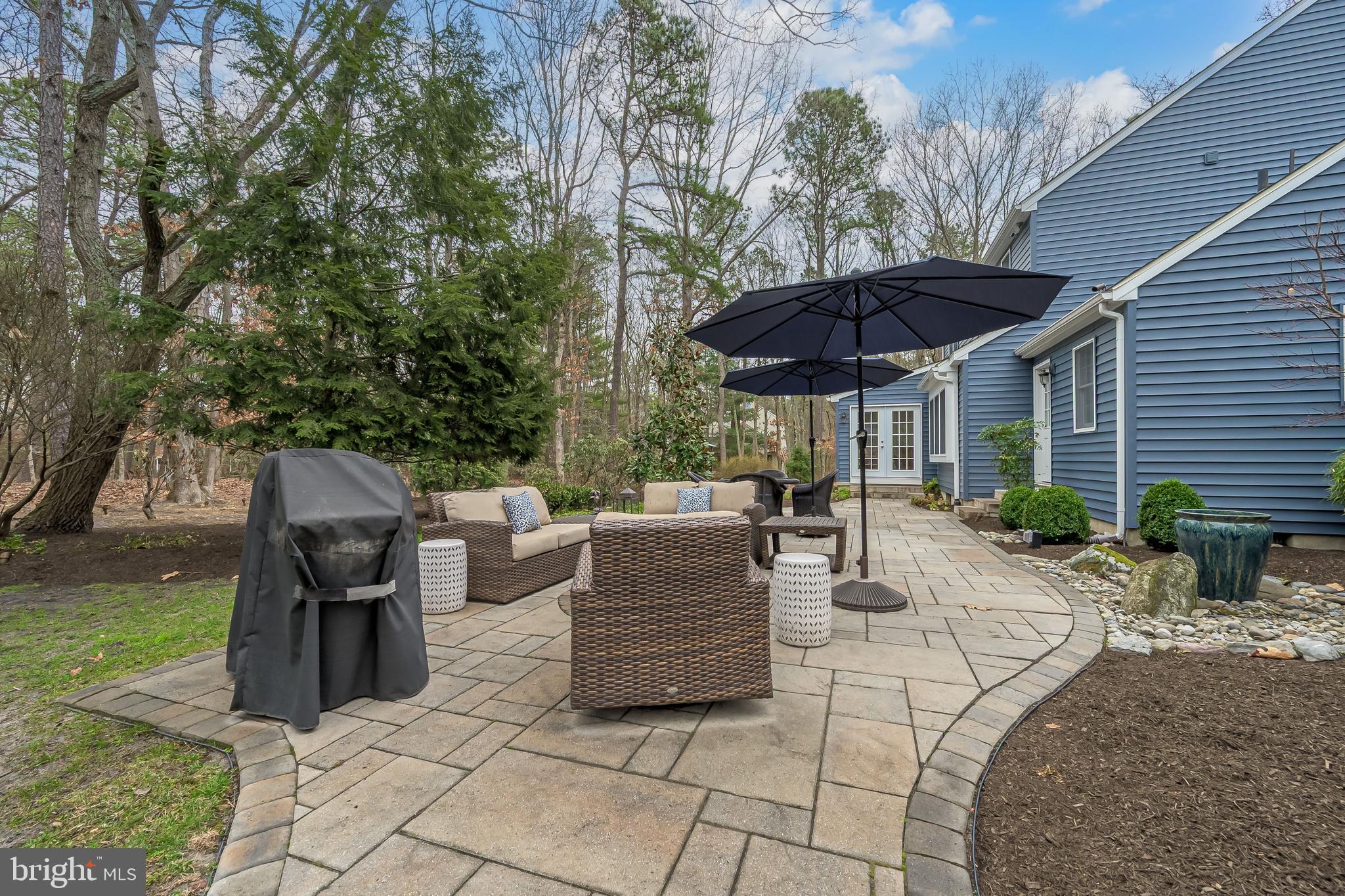 13 Pointe View Drive Medford, NJ 08055 - Photo 4 of 33 a view of a patio with table and chairs under an umbrella