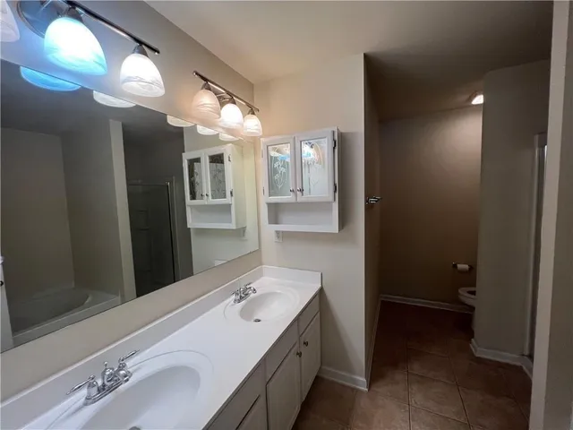 a bathroom with a sink and mirror