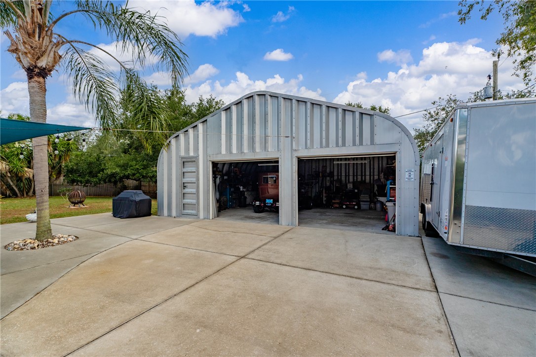 7666 134th Street Sebastian, FL 32958 - Photo 30 of 35 a view of a house with a yard and furniture
