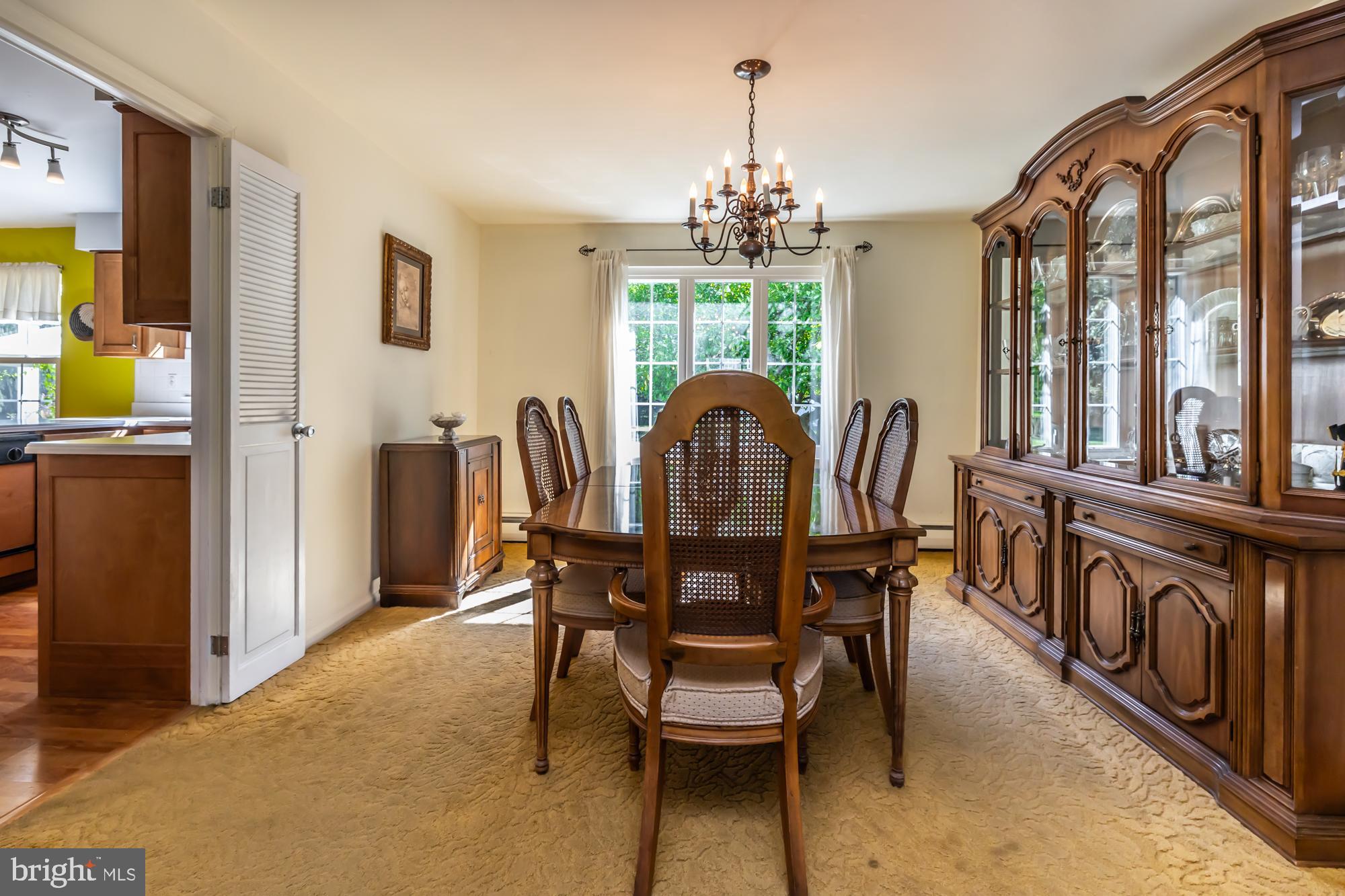 12 Flintshire Road Malvern, PA 19355 - Photo 13 of 50 a view of a dining room with furniture a chandelier and a window