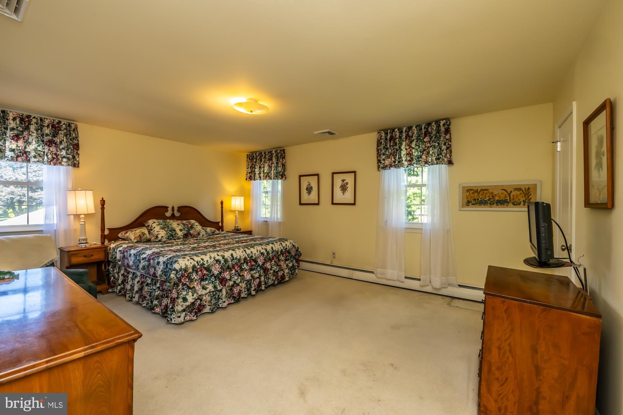 12 Flintshire Road Malvern, PA 19355 - Photo 31 of 50 a bedroom with a bed and wooden floor