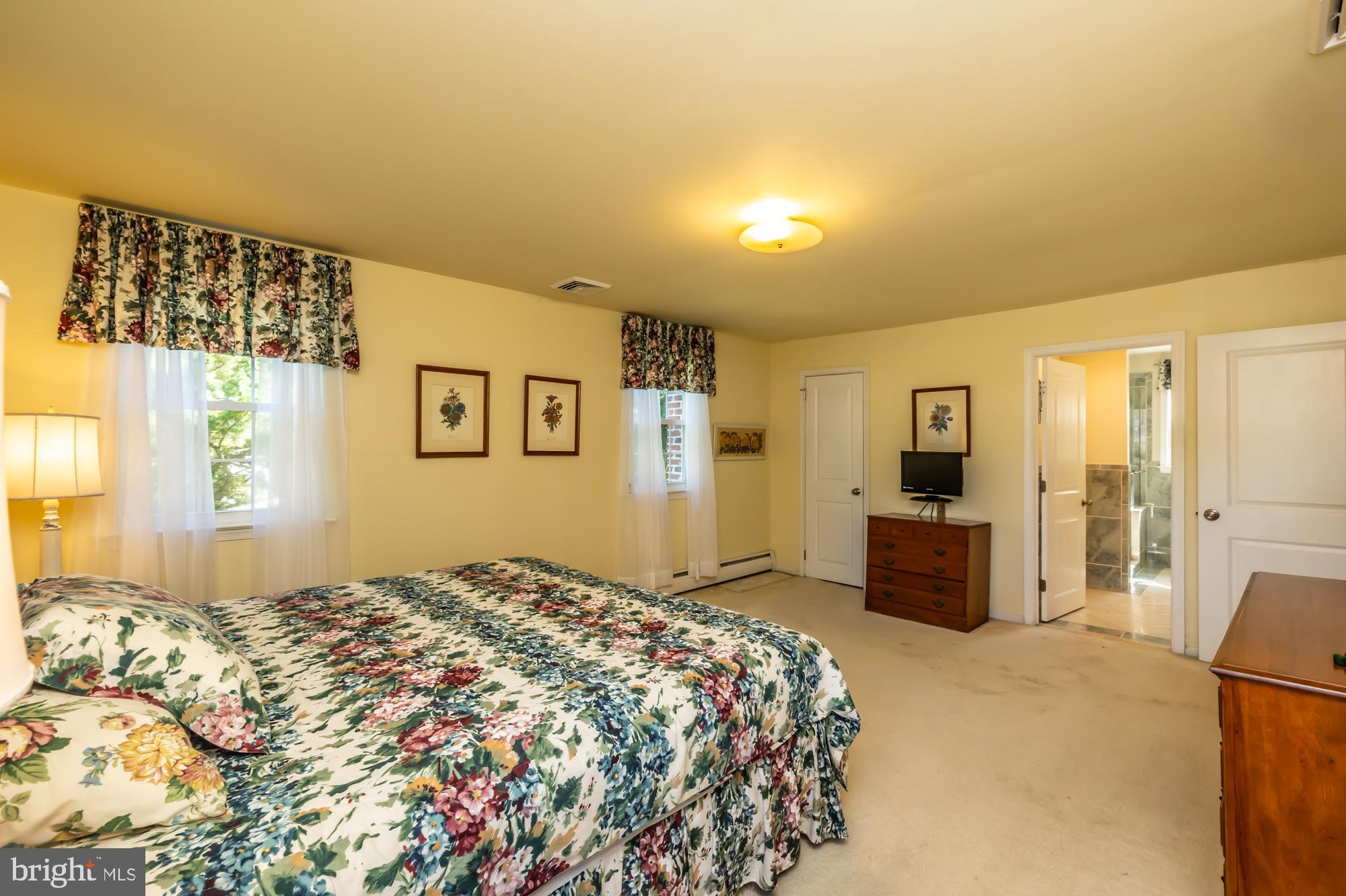 12 Flintshire Road Malvern, PA 19355 - Photo 33 of 50 a bedroom with a bed and a couch