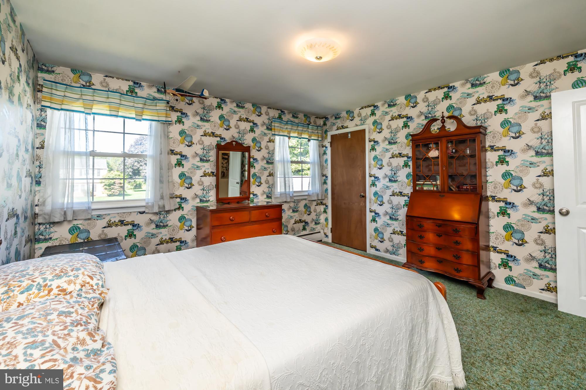 12 Flintshire Road Malvern, PA 19355 - Photo 37 of 50 a bedroom with a bed and a dresser next to a window