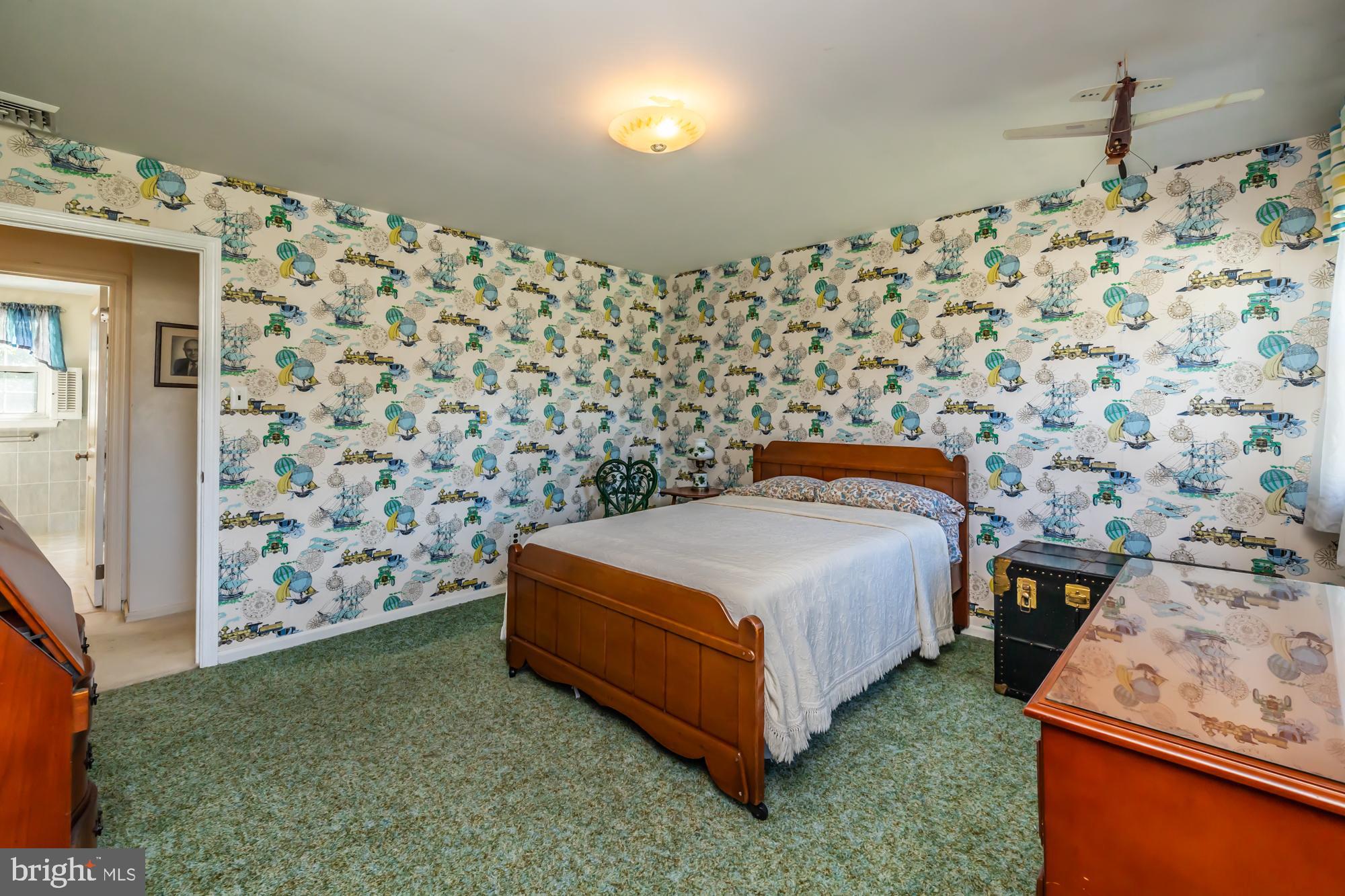 12 Flintshire Road Malvern, PA 19355 - Photo 38 of 50 a bedroom with a bed and a wall painting