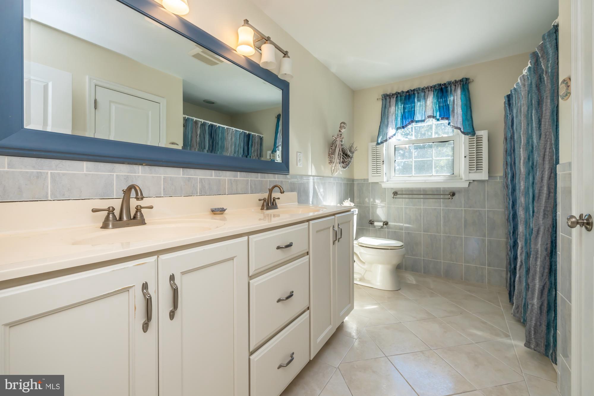 12 Flintshire Road Malvern, PA 19355 - Photo 39 of 50 a spacious bathroom with a double vanity sink mirror and toilet