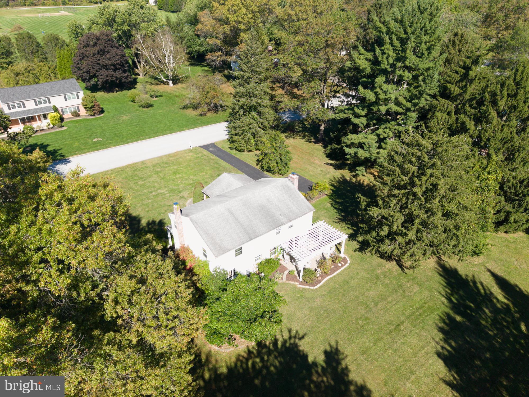 12 Flintshire Road Malvern, PA 19355 - Photo 6 of 50 an aerial view of a house with yard swimming pool and outdoor seating