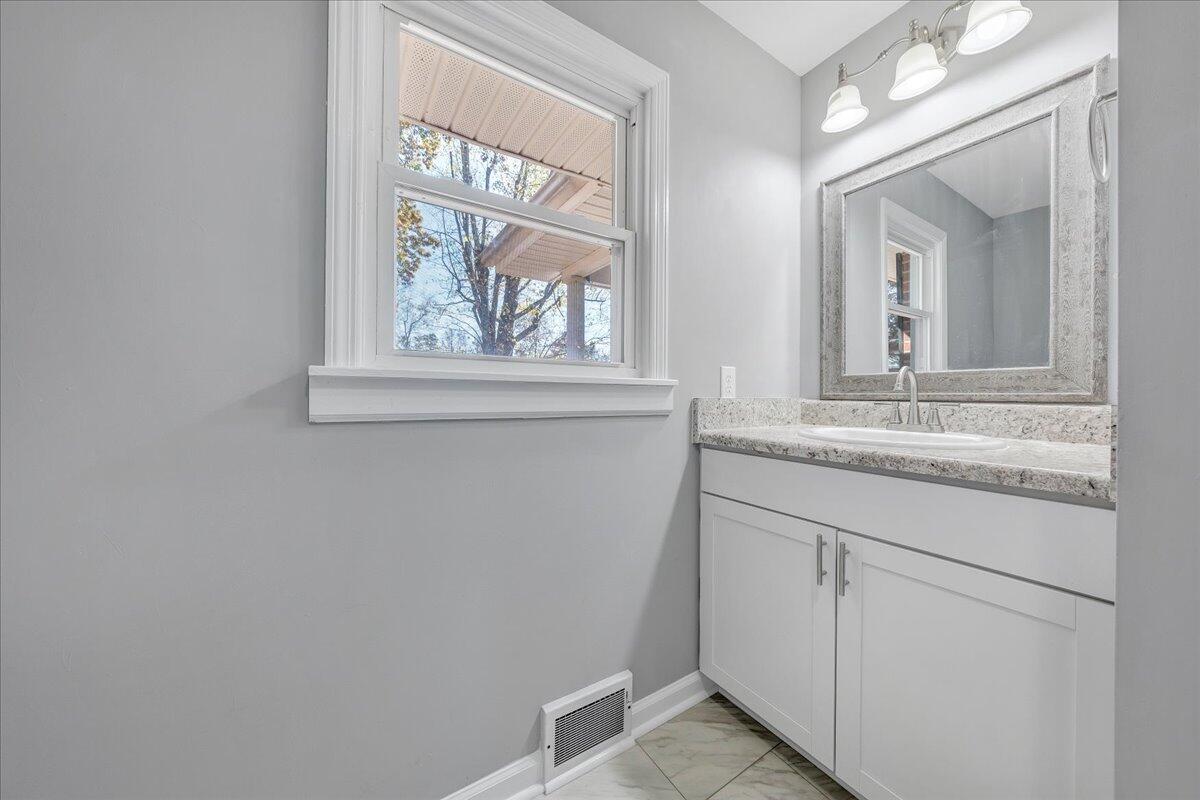 2353 Thompson Ridge Road Ferrum, VA 24088 - Photo 21 of 46 a bathroom with a sink and a mirror