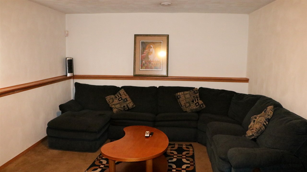 3950 Linden Road Rockford, IL 61109 - Photo 5 of 12 a living room with furniture and a wooden floor