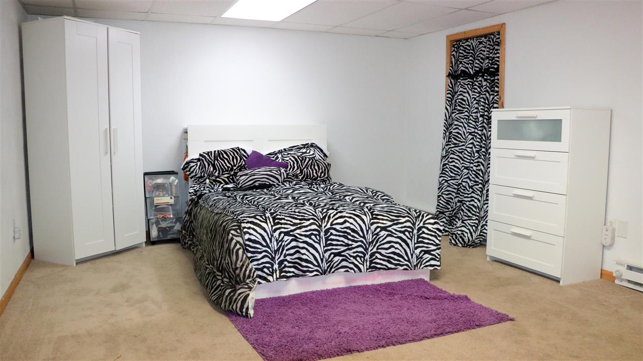3950 Linden Road Rockford, IL 61109 - Photo 7 of 12 a bedroom with a bed and a window