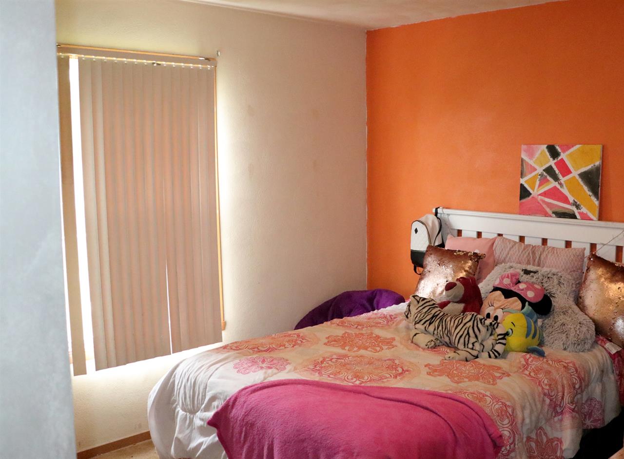 3950 Linden Road Rockford, IL 61109 - Photo 8 of 12 a bedroom with a bed and a window
