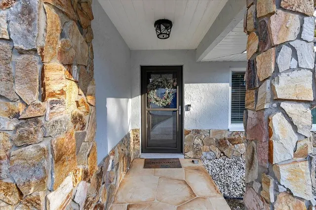 a kitchen with stainless steel appliances granite countertop a stove and a refrigerator