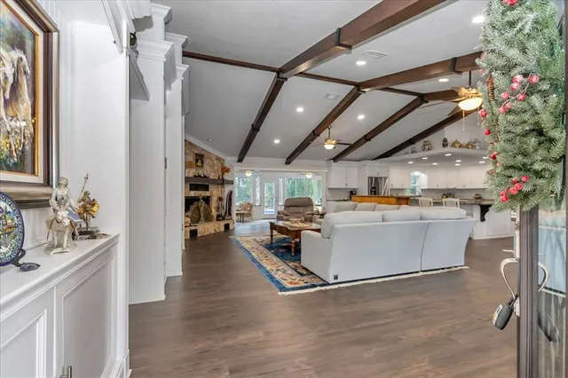 a open kitchen with stainless steel appliances granite countertop a stove and cabinets