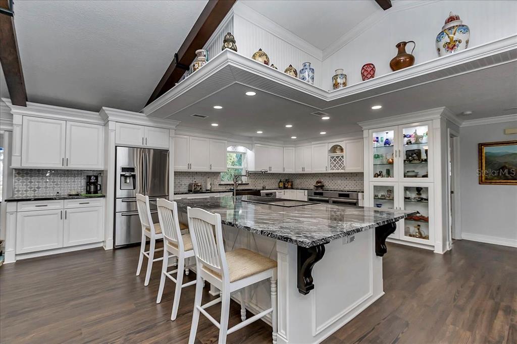 223 South Nesbitt Terrace Inverness, FL 34450 - Photo 17 of 85 a large kitchen with a table and chairs