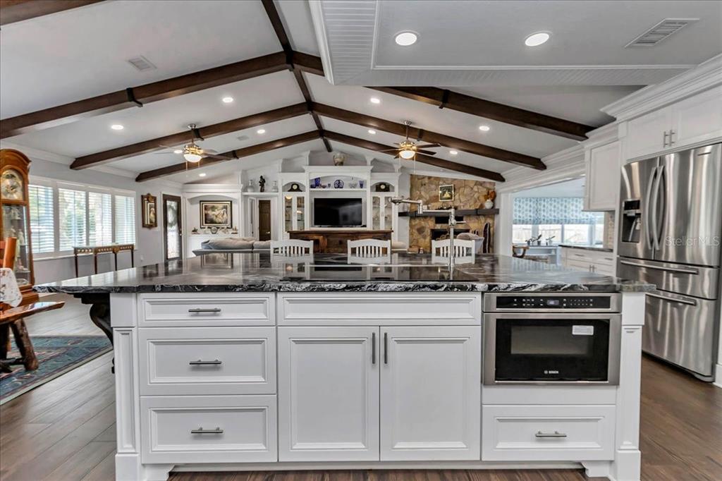 223 South Nesbitt Terrace Inverness, FL 34450 - Photo 22 of 85 a kitchen with stainless steel appliances granite countertop a stove and a refrigerator
