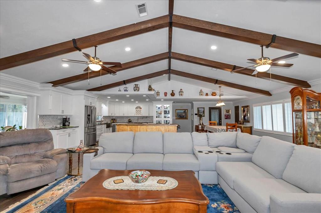 223 South Nesbitt Terrace Inverness, FL 34450 - Photo 24 of 85 a living room with furniture and a chandelier