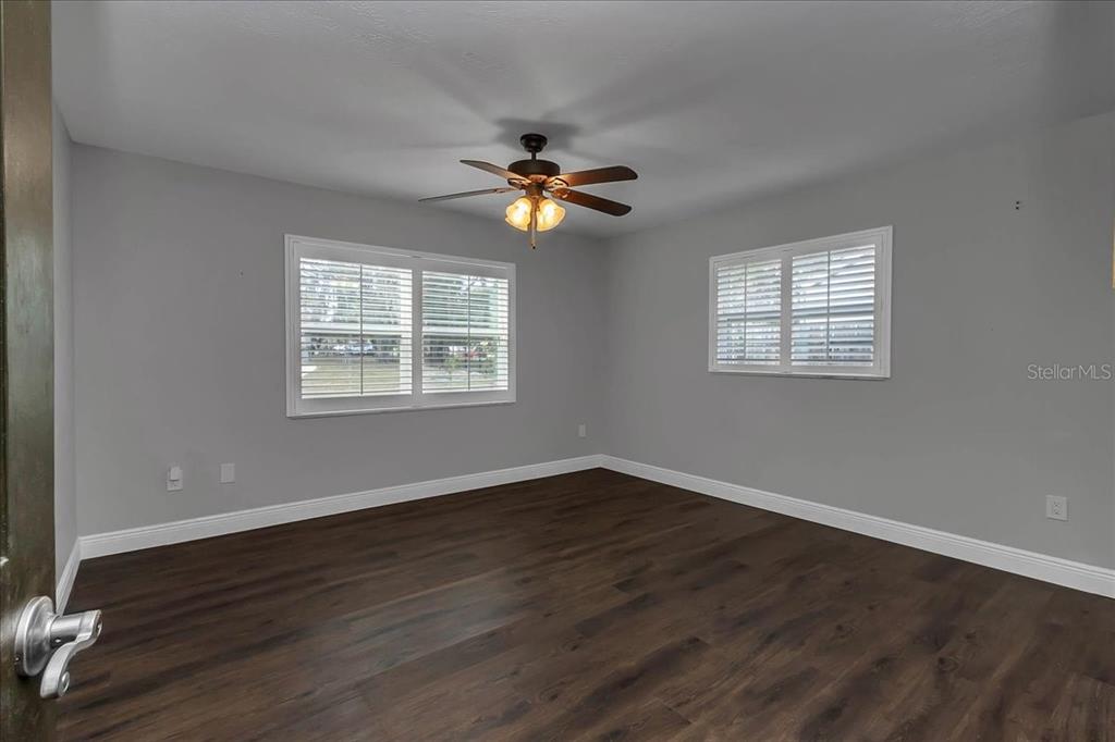 223 South Nesbitt Terrace Inverness, FL 34450 - Photo 29 of 85 a view of an empty room with wooden floor and a window