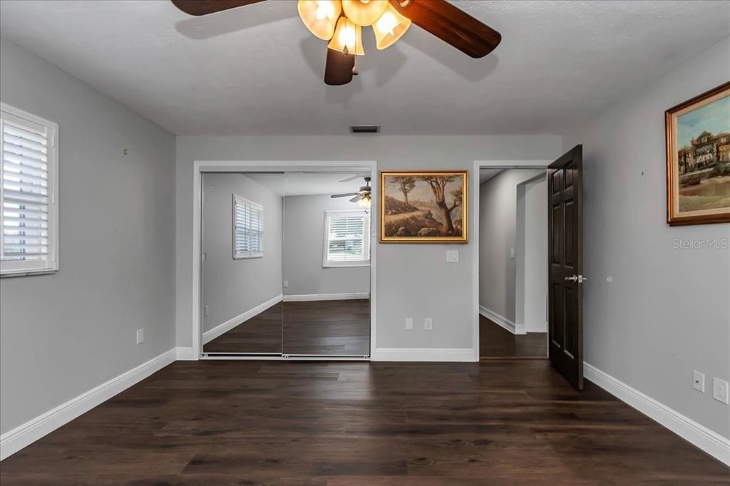 223 South Nesbitt Terrace Inverness, FL 34450 - Photo 30 of 85 a view of an empty room with window and wooden floor