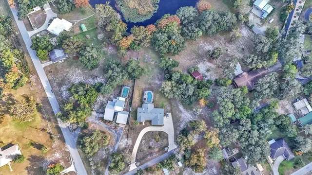 an aerial view of residential house with outdoor space