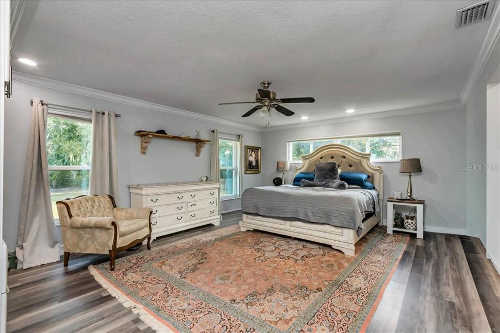 223 South Nesbitt Terrace Inverness, FL 34450 - Photo 38 of 85 a bedroom with a bed and a large window