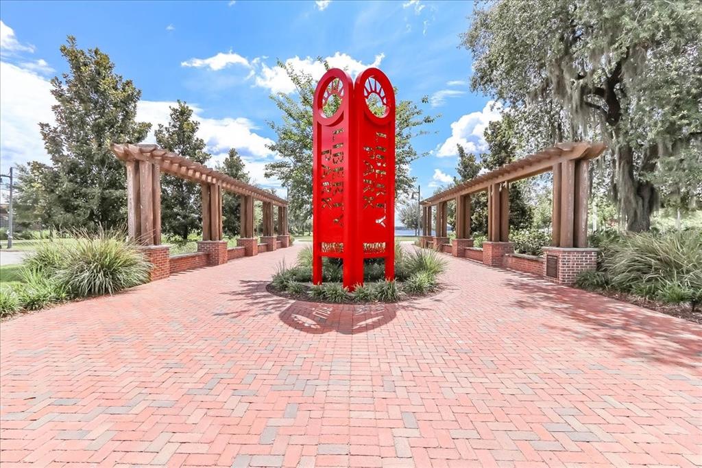 223 South Nesbitt Terrace Inverness, FL 34450 - Photo 80 of 85 a front view of a house with a yard and potted plants