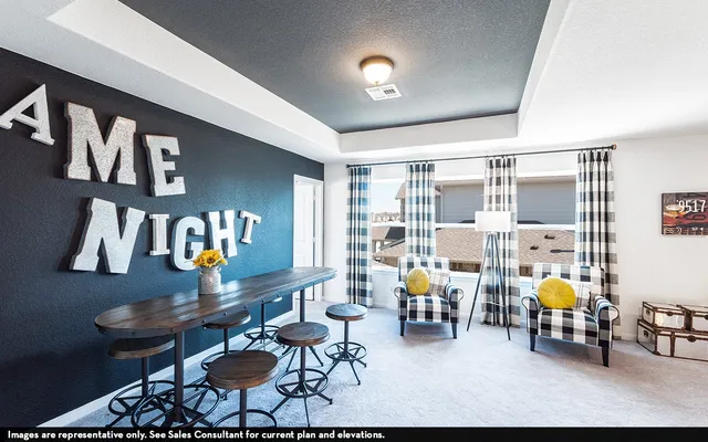 a living room with furniture and next to a window