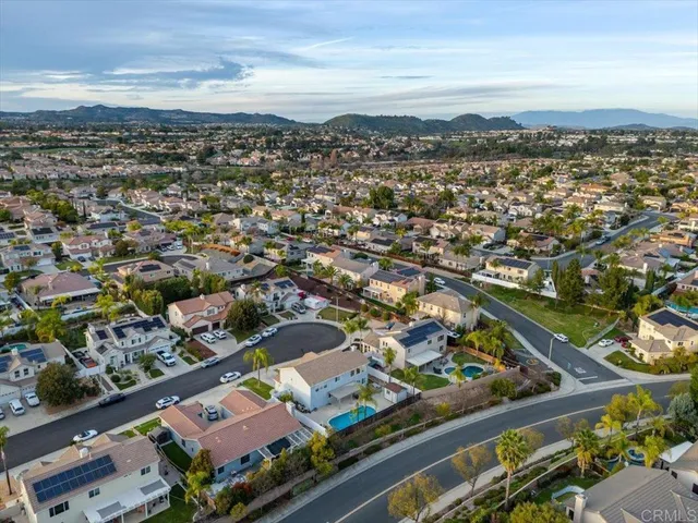 an aerial view of residential building and ocean