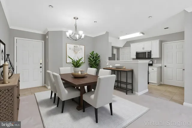 a view of a dining room with furniture and a kitchen