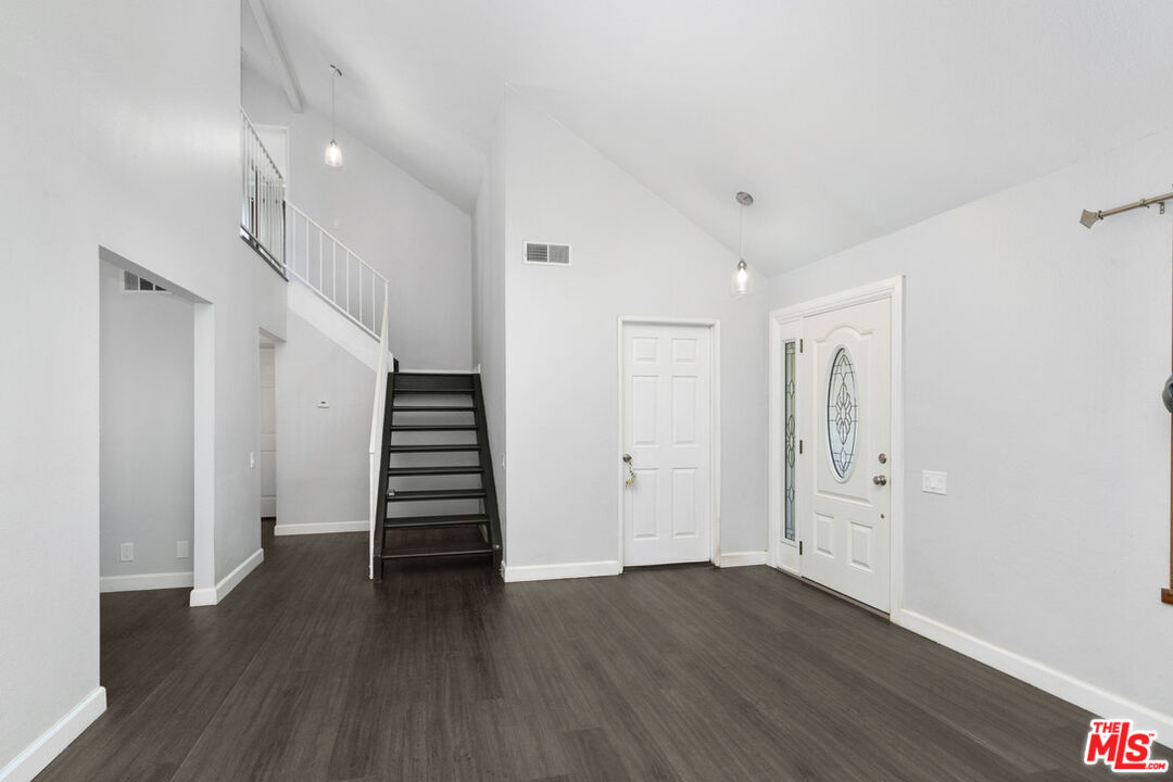 6703 Poinsettia Court Chino, CA 91710 - Photo 12 of 36 a view of a hallway with wooden floor and entryway