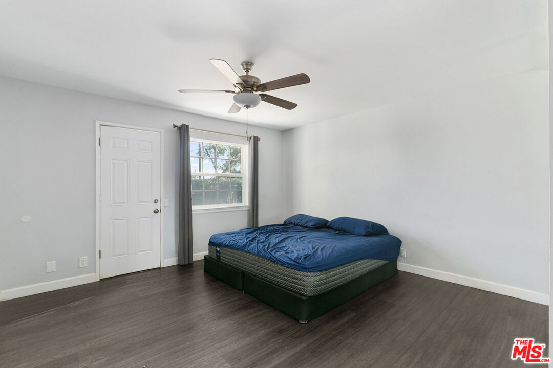 6703 Poinsettia Court Chino, CA 91710 - Photo 15 of 36 a living room with a bed furniture and a window