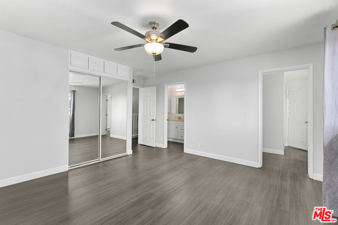 6703 Poinsettia Court Chino, CA 91710 - Photo 18 of 36 an empty room with wooden floor and a ceiling fan