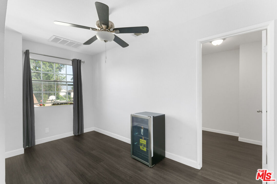 6703 Poinsettia Court Chino, CA 91710 - Photo 23 of 36 a view of an empty room with wooden floor and a window