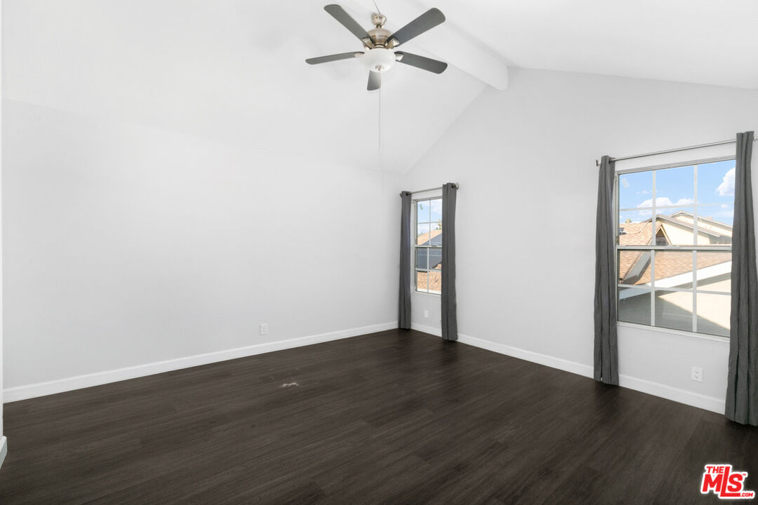 6703 Poinsettia Court Chino, CA 91710 - Photo 24 of 36 an empty room with wooden floor fan and windows